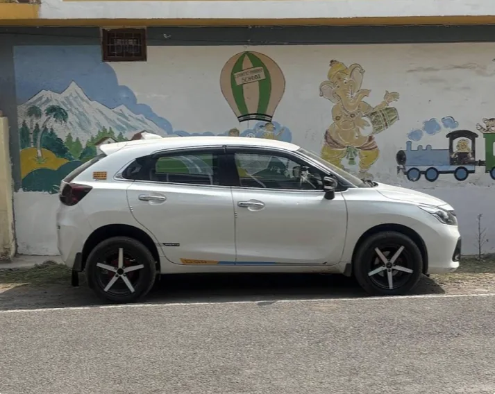 White hatchback taxi, side view